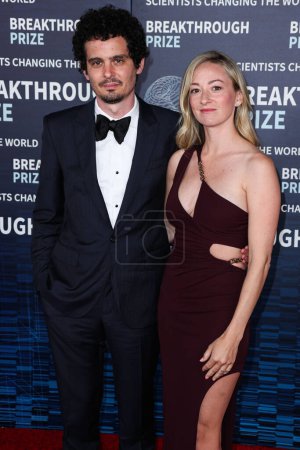 Photo for Damien Chazelle and wife Olivia Hamilton arrive at the 9th Annual Breakthrough Prize Ceremony held at the Academy Museum of Motion Pictures on April 15, 2023 in Los Angeles, California, United States. - Royalty Free Image