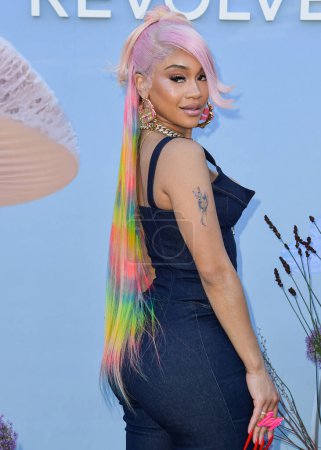 Photo for Saweetie arrives at the REVOLVE Festival 2023 celebrating the 20th Anniversary of REVOLVE in partnership with The h.wood Group on April 15, 2023 in Thermal, Coachella Valley, Riverside County, California, United States. - Royalty Free Image