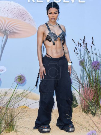 Photo for Teyana Taylor arrives at the REVOLVE Festival 2023 celebrating the 20th Anniversary of REVOLVE in partnership with The h.wood Group on April 15, 2023 in Thermal, Coachella Valley, Riverside County, California, United States. - Royalty Free Image