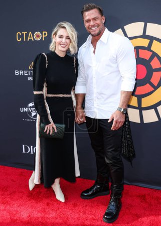 Photo for Catherine Ritchson and husband Alan Ritchson arrive at the Charlize Theron Africa Outreach Project (CTAOP) 2023 Block Party held at the Universal Studios Backlot on May 20, 2023 in Universal City, Los Angeles, California, United States. - Royalty Free Image
