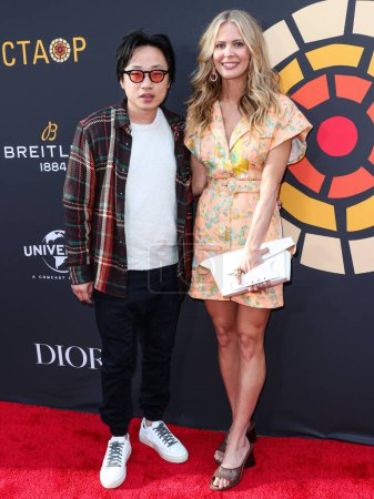 Photo for Jimmy O. Yang and girlfriend Brianne Kimmel arrive at the Charlize Theron Africa Outreach Project (CTAOP) 2023 Block Party held at the Universal Studios Backlot on May 20, 2023 in Universal City, Los Angeles, California, United States. - Royalty Free Image