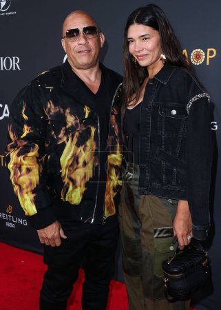 Photo for Vin Diesel and wife Paloma Jimenez arrive at the Charlize Theron Africa Outreach Project (CTAOP) 2023 Block Party held at the Universal Studios Backlot on May 20, 2023 in Universal City, Los Angeles, California, United States. - Royalty Free Image