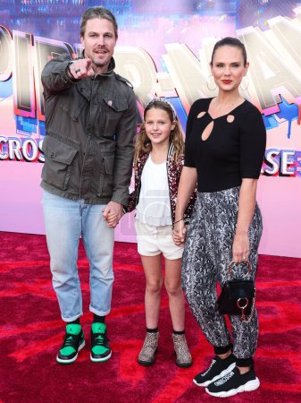 Photo for Stephen Amell, Maverick Alexandra Jean Amell and Cassandra Jean arrive at the World Premiere Of Sony Pictures Animation's 'Spider-Man: Across The Spider Verse' held at the Regency Village Theater on May 30, 2023 in Westwood, Los Angeles, California - Royalty Free Image
