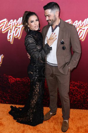Photo for Eva Longoria and Jesse Metcalfe arrive at the Los Angeles Special Screening Of Searchlight Pictures' 'Flamin' Hot' held at the Hollywood American Legion Post 43 at Hollywood Legion Theater on June 9, 2023 in Hollywood, Los Angeles, California - Royalty Free Image