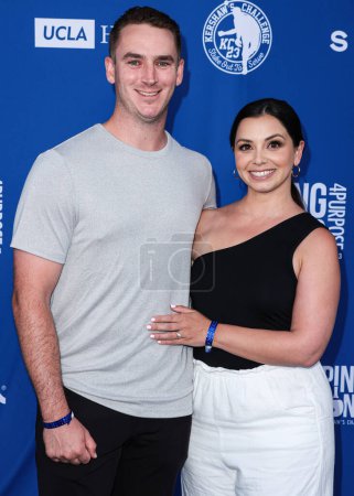 Photo for Evan Phillips and Elizabeth Phillips arrive at Kershaw's Challenge 10th Annual Ping Pong 4 Purpose 2023 Charity Event Celebrity Tournament held at Dodger Stadium on July 27, 2023 in Elysian Park, Los Angeles, California, United States. - Royalty Free Image