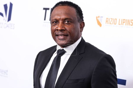 Photo for American former professional football wide receiver Tim Brown arrives at the 23rd Annual Harold And Carole Pump Foundation Gala held at The Beverly Hilton Hotel on August 18, 2023 in Beverly Hills, Los Angeles, California, United States. - Royalty Free Image