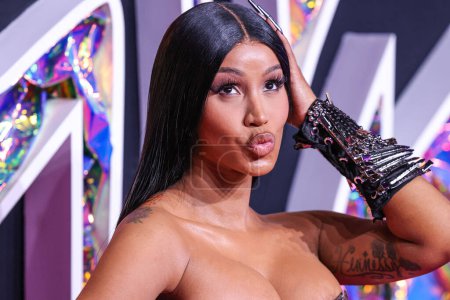 Photo for Cardi B wearing a Dilara Findikoglu dress arrives at the 2023 MTV Video Music Awards held at the Prudential Center on September 12, 2023 in Newark, New Jersey, United States. - Royalty Free Image