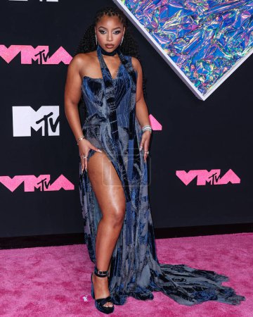 Photo for Chloe Bailey wearing a Roberto Cavalli denim dress arrives at the 2023 MTV Video Music Awards held at the Prudential Center on September 12, 2023 in Newark, New Jersey, United States. - Royalty Free Image