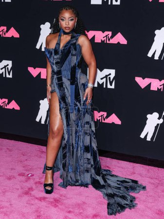 Photo for Chloe Bailey wearing a Roberto Cavalli denim dress arrives at the 2023 MTV Video Music Awards held at the Prudential Center on September 12, 2023 in Newark, New Jersey, United States. - Royalty Free Image