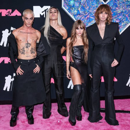 Photo for Damiano David, Ethan Torchio, Victoria De Angelis and Thomas Raggi of Mneskin (Maneskin) wearing outfits by Rick Owens arrive at the 2023 MTV Video Music Awards held at the Prudential Center on September 12, 2023 in Newark, New Jersey, USA - Royalty Free Image