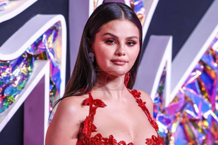 Photo for American singer and actress Selena Gomez wearing a custom Oscar de la Renta dress arrives at the 2023 MTV Video Music Awards held at the Prudential Center on September 12, 2023 in Newark, New Jersey, United States. - Royalty Free Image