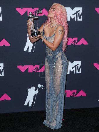 Photo for Karol G poses with the Best Collaboration award for 'TQG' in the press room at the 2023 MTV Video Music Awards held at the Prudential Center on September 12, 2023 in Newark, New Jersey, United States. - Royalty Free Image