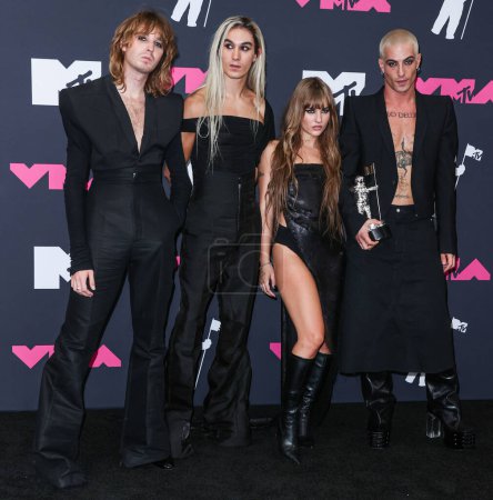 Photo for Thomas Raggi, Ethan Torchio, Victoria De Angelis and Damiano David of Mneskin (Maneskin) pose in the press room at the 2023 MTV Video Music Awards held at the Prudential Center on September 12, 2023 in Newark, New Jersey, United States. - Royalty Free Image