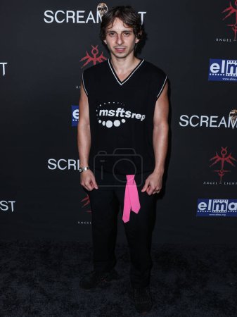 Photo for American actor Moises Arias arrives at the 23rd Annual Screamfest Horror Film Festival - Opening Night - Los Angeles Premiere Of Sumerian Films 'Divinity' held at the TCL Chinese Theatre IMAX on October 10, 2023 in Hollywood, Los Angeles, California - Royalty Free Image
