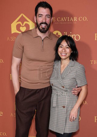Photo for Canadian reality television personality Drew Scott and wife Linda Phan arrive at the annual, A Sense of Home Gala 2023, to help prevent homelessness by creating first ever homes and a community for youth aging out of foster care - Royalty Free Image