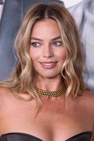 Photo for Australian actress and film producer Margot Robbie wearing a Schiaparelli dress arrives at the Los Angeles Premiere Of Amazon MGM Studios' 'Saltburn' held at The Theatre at Ace Hotel on November 14, 2023 in Los Angeles, California, United States. - Royalty Free Image
