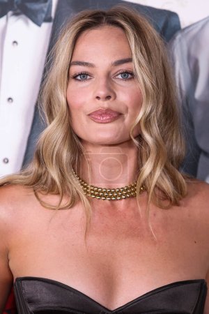 Photo for Australian actress and film producer Margot Robbie wearing a Schiaparelli dress arrives at the Los Angeles Premiere Of Amazon MGM Studios' 'Saltburn' held at The Theatre at Ace Hotel on November 14, 2023 in Los Angeles, California, United States. - Royalty Free Image