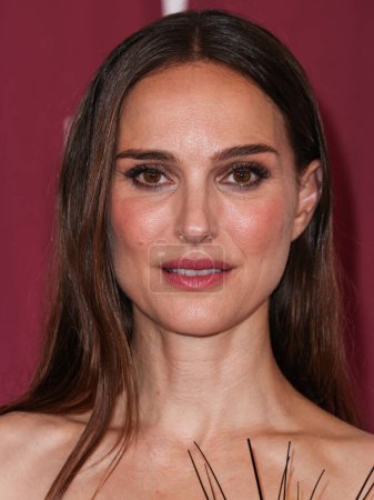 Photo for Israeli-American actress Natalie Portman wearing a Schiaparelli dress arrives at the Los Angeles Premiere Of Netflix's 'May December' held at the Academy Museum of Motion Pictures on November 16, 2023 in Los Angeles, California, United States. - Royalty Free Image