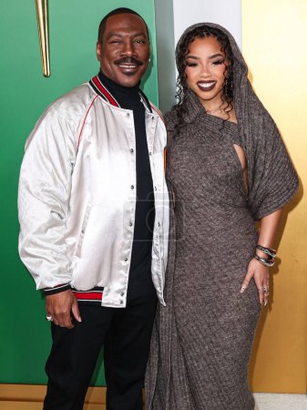 Photo for Eddie Murphy and Chloe Bailey arrive at the World Premiere Of Amazon Prime Video's 'Candy Cane Lane' held at the Regency Village Theatre on November 28, 2023 in Westwood, Los Angeles, California, United States. - Royalty Free Image