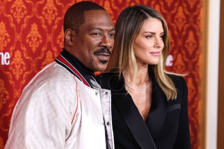 Photo for Eddie Murphy and fiance Paige Butcher arrive at the World Premiere Of Amazon Prime Video's 'Candy Cane Lane' held at the Regency Village Theatre on November 28, 2023 in Westwood, Los Angeles, California, United States. - Royalty Free Image
