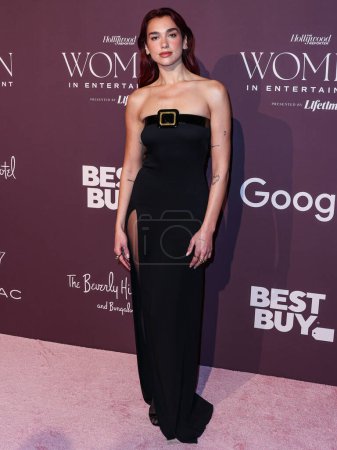 Photo for English-Albanian singer and songwriter Dua Lipa arrives at The Hollywood Reporter's Women In Entertainment Gala 2023 presented by Lifetime held at The Beverly Hills Hotel on December 7, 2023 in Beverly Hills, Los Angeles, California, United States. - Royalty Free Image