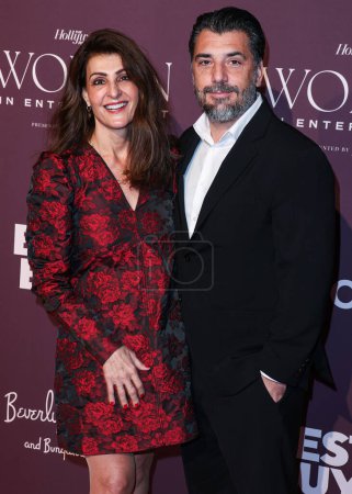 Photo for Canadian actress and screenwriter Nia Vardalos and Spiros Katsagans arrive at The Hollywood Reporter's Women In Entertainment Gala 2023 presented by Lifetime held at The Beverly Hills Hotel on December 7, 2023 in Beverly Hills, Los Angeles - Royalty Free Image