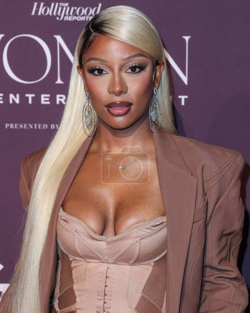 Photo for American singer-songwriter Victoria Mont (Victoria Monet) arrives at The Hollywood Reporter's Women In Entertainment Gala 2023 presented by Lifetime held at The Beverly Hills Hotel on December 7, 2023 in Beverly Hills, Los Angeles, California, USA - Royalty Free Image