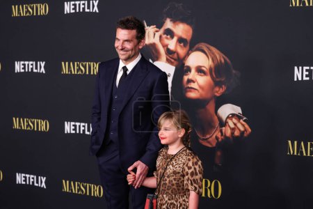 Photo for American actor and filmmaker Bradley Cooper wearing a Louis Vuitton suit and daughter Lea De Seine Shayk Cooper arrive at the Los Angeles Special Screening Of Netflix's 'Maestro' held at the Academy Museum of Motion Pictures on December 12, 2023 - Royalty Free Image
