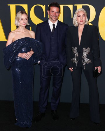 Photo for Carey Mulligan , American actor and filmmaker Bradley Cooper  and Lady Gaga wearing an Alexander McQueen suit arrive at  'Maestro' held at the Academy Museum of Motion Pictures on December 12, 2023 in Los Angeles, California, United States. - Royalty Free Image