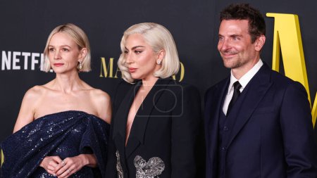 Photo for Carey Mulligan , American actor and filmmaker Bradley Cooper  and Lady Gaga wearing an Alexander McQueen suit arrive at  'Maestro' held at the Academy Museum of Motion Pictures on December 12, 2023 in Los Angeles, California, United States. - Royalty Free Image