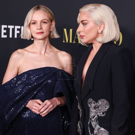 Photo for Carey Mulligan and  Lady Gaga wearing an Alexander McQueen suit arrive at the Los Angeles Special Screening Of Netflix's 'Maestro' held at the Academy Museum of Motion Picture on December 12, 2023 at the Los Angeles - Royalty Free Image