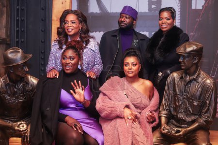 Photo for Danielle Brooks, Blitz Bazawule, Fantasia Barrino, Taraji P. Henson and Oprah Winfrey attend as Oprah Winfrey And The Cast Of Warner Bros.' 'The Color Purple' Light The Empire State Building PURPLE to celebrate the 2023 film's release on December 12 - Royalty Free Image