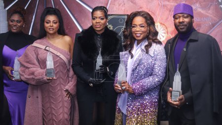 Photo for Danielle Brooks, Taraji P. Henson, Fantasia Barrino, Oprah Winfrey and Blitz Bazawule attend as Oprah Winfrey And The Cast Of Warner Bros.' 'The Color Purple' Light The Empire State Building PURPLE to celebrate the 2023 film's release on December 12 - Royalty Free Image