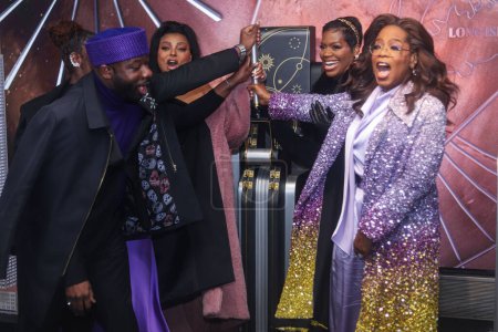 Photo for Blitz Bazawule, Danielle Brooks, Taraji P. Henson, Fantasia Barrino and Oprah Winfrey attend as Oprah Winfrey And The Cast Of Warner Bros.' 'The Color Purple' Light The Empire State Building PURPLE to celebrate the 2023 film's release on December 12 - Royalty Free Image