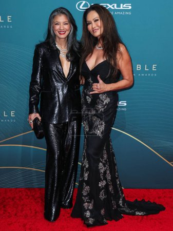 Photo for Kelly Hu and Tia Carrere arrive at the 21st Annual Unforgettable Gala Asian American Awards held at The Beverly Hilton Hotel on December 16, 2023 in Beverly Hills, Los Angeles, California, United States. - Royalty Free Image