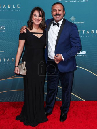 Photo for Taslim Manji and Rizwan Manji arrive at the 21st Annual Unforgettable Gala Asian American Awards held at The Beverly Hilton Hotel on December 16, 2023 in Beverly Hills, Los Angeles, California, United States. - Royalty Free Image