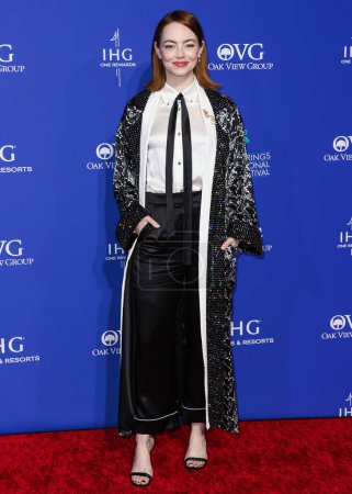 Photo for Emma Stone wearing custom Louis Vuitton arrives at the 35th Annual Palm Springs International Film Festival Film Awards held at the Palm Springs Convention Center on January 4, 2024 in Palm Springs, Riverside County, California, United States. - Royalty Free Image