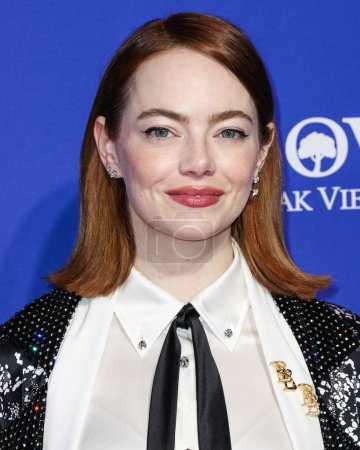 Photo for Emma Stone wearing custom Louis Vuitton arrives at the 35th Annual Palm Springs International Film Festival Film Awards held at the Palm Springs Convention Center on January 4, 2024 in Palm Springs, Riverside County, California, United States. - Royalty Free Image