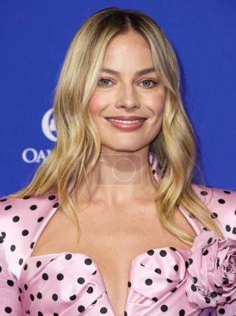 Photo for Margot Robbie wearing a Balmain dress arrives at the 35th Annual Palm Springs International Film Festival Film Awards held at the Palm Springs Convention Center on January 4, 2024 in Palm Springs, Riverside County, California, United States. - Royalty Free Image