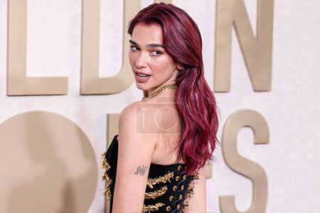 Photo for Dua Lipa wearing a custom Schiaparelli dress, Jimmy Choo shoes and Tiffany and Co. jewelry arrives at the 81st Annual Golden Globe Awards held at The Beverly Hilton Hotel on January 7, 2024 in Beverly Hills, Los Angeles, California, United States. - Royalty Free Image