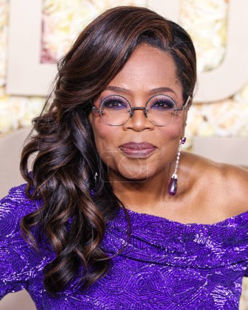Photo for Oprah Winfrey wearing a Louis Vuitton dress, Manolo Blahnik shoes, and Chopard jewels arrives at the 81st Annual Golden Globe Awards held at The Beverly Hilton Hotel on January 7, 2024 in Beverly Hills, Los Angeles, California, United States. - Royalty Free Image