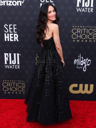 Photo for Abigail Spencer wearing a Saiid Kobeisy dress, Christian Louboutin shoes, a Loewe clutch, and jewelry by Samer Halimeh and Kallati arrives at the 29th Annual Critics' Choice Awards held at The Barker Hangar on January 14, 2024 in Santa Monica - Royalty Free Image