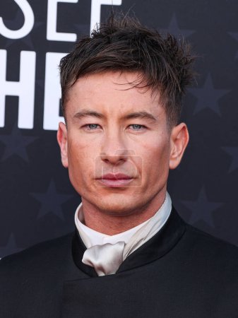 Photo for Barry Keoghan wearing a Zegna suit, Christian Louboutin shoes, and an Omega watch arrives at the 29th Annual Critics' Choice Awards held at The Barker Hangar on January 14, 2024 in Santa Monica, Los Angeles, California, United States. - Royalty Free Image