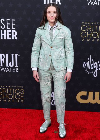 Photo for Bella Ramsey wearing Thom Browne arrives at the 29th Annual Critics' Choice Awards held at The Barker Hangar on January 14, 2024 in Santa Monica, Los Angeles, California, United States. - Royalty Free Image