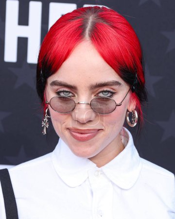 Photo for Billie Eilish wearing Thom Browne with Oliver Peoples glasses arrives at the 29th Annual Critics' Choice Awards held at The Barker Hangar on January 14, 2024 in Santa Monica, Los Angeles, California, United States. - Royalty Free Image