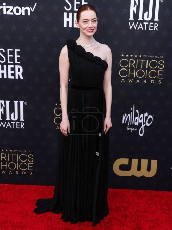 Photo for Emma Stone wearing Louis Vuitton arrives at the 29th Annual Critics' Choice Awards held at The Barker Hangar on January 14, 2024 in Santa Monica, Los Angeles, California, United States - Royalty Free Image