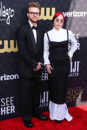 Photo for Finneas O'Connell and sister Billie Eilish arrive at the 29th Annual Critics' Choice Awards held at The Barker Hangar on January 14, 2024 in Santa Monica, Los Angeles, California, United States. - Royalty Free Image