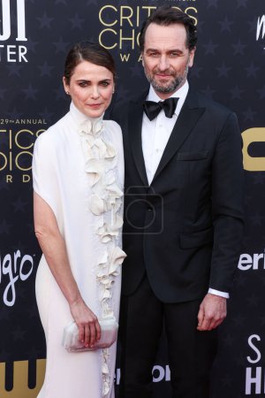 Photo for Keri Russell and partner Matthew Rhys arrive at the 29th Annual Critics' Choice Awards held at The Barker Hangar on January 14, 2024 in Santa Monica, Los Angeles, California, United States. - Royalty Free Image