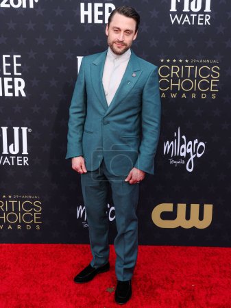 Photo for Kieran Culkin wearing Zegna with a Martin Katz pin arrives at the 29th Annual Critics' Choice Awards held at The Barker Hangar on January 14, 2024 in Santa Monica, Los Angeles, California, United States. - Royalty Free Image