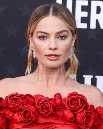 Photo for Margot Robbie wearing custom Balmain arrives at the 29th Annual Critics' Choice Awards held at The Barker Hangar on January 14, 2024 in Santa Monica, Los Angeles, California, United States. - Royalty Free Image